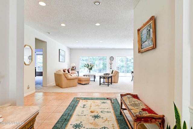 21 Raven Glass Ln, Bluffton, SC 29909 - carpeted living area featuring tile patterned floors, a textured ceiling, recessed lighting, and baseboards