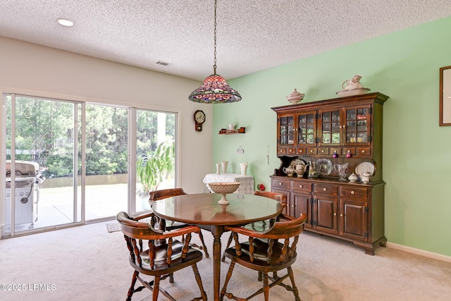 21 Raven Glass Ln, Bluffton, SC 29909 - dining room with light carpet and a textured ceiling