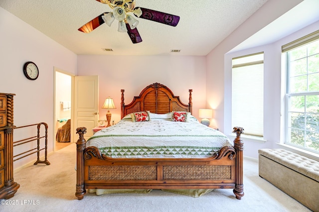 21 Raven Glass Ln, Bluffton, SC 29909 - bedroom featuring light carpet, a textured ceiling, and a ceiling fan