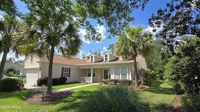21 Raven Glass Ln, Bluffton, SC 29909 - view of front of home with an attached garage, stucco siding, and a front lawn