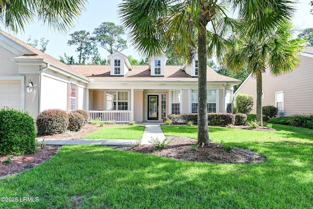 21 Raven Glass Ln, Bluffton, SC 29909 - view of front facade featuring a front lawn, covered porch, stucco siding, and a garage