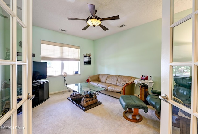 21 Raven Glass Ln, Bluffton, SC 29909 - living area featuring carpet floors, a ceiling fan, baseboards, and a textured ceiling