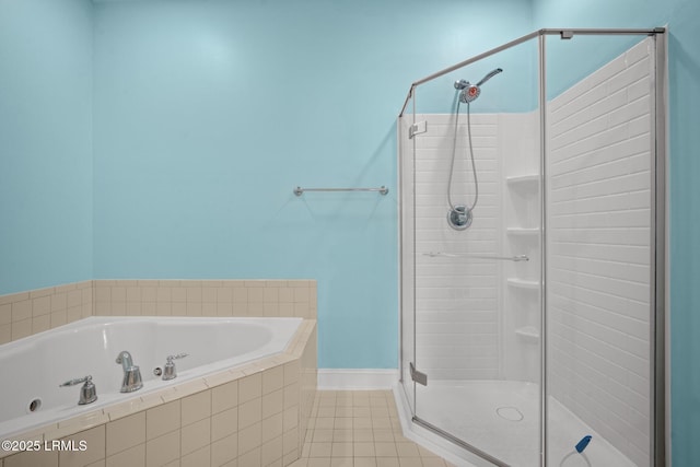 bathroom featuring independent shower and bath and tile patterned flooring