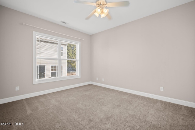 carpeted empty room with ceiling fan