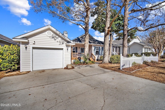 single story home with a garage and covered porch