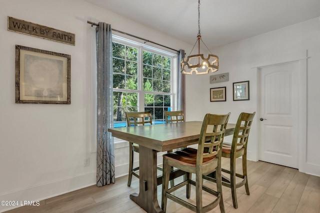 dining area with light hardwood / wood-style floors