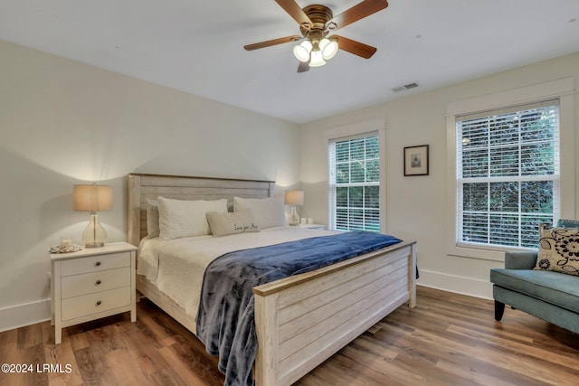 bedroom featuring dark wood-type flooring and ceiling fan