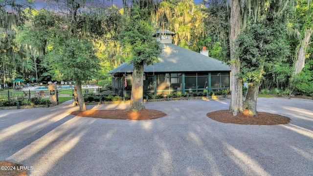 view of front of house featuring a sunroom