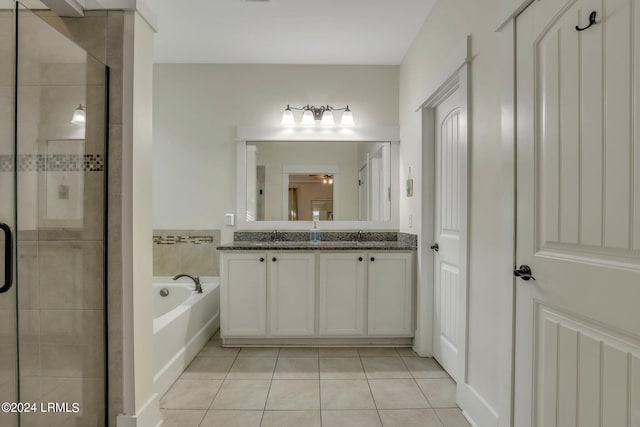 bathroom featuring tile patterned flooring, shower with separate bathtub, vanity, and ceiling fan