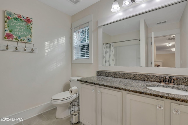 bathroom with vanity, tile patterned flooring, a shower with curtain, and toilet