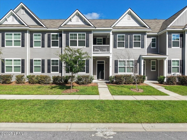 86 Slater St, Bluffton, SC 29909 - townhome / multi-family property featuring a balcony and a front lawn