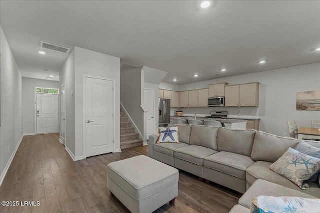 86 Slater St, Bluffton, SC 29909 - living room with dark wood-type flooring, stairway, and recessed lighting