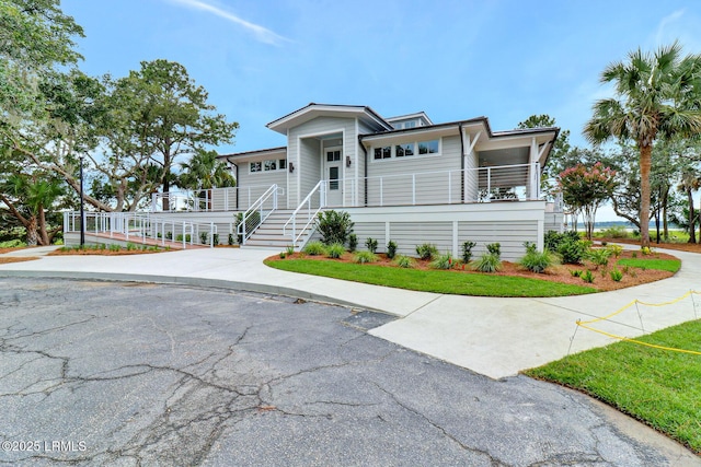 196 White Oaks Cir, Bluffton, SC 29910 - view of front of house with covered porch, stairway, and driveway