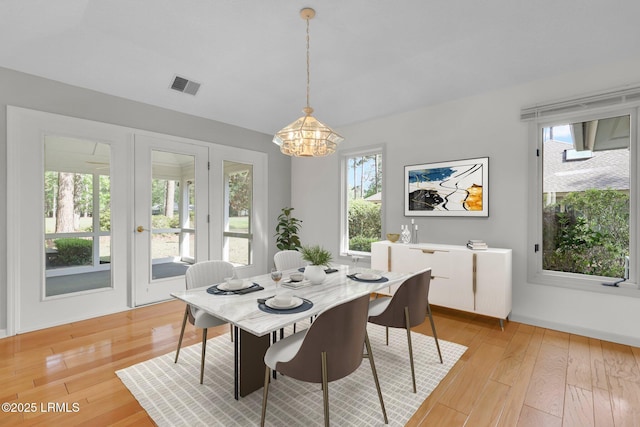 196 White Oaks Cir, Bluffton, SC 29910 - dining space with visible vents, light wood-style floors, a chandelier, and a wealth of natural light