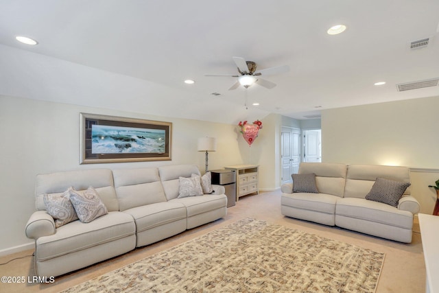 living area with ceiling fan, recessed lighting, visible vents, and light carpet