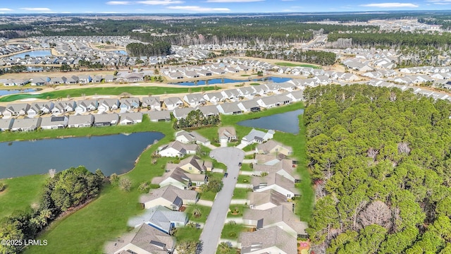 bird's eye view featuring a residential view and a water view