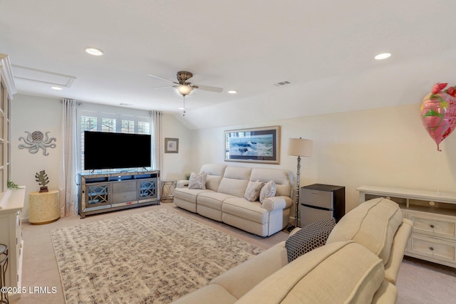 carpeted living room featuring recessed lighting, visible vents, attic access, and vaulted ceiling