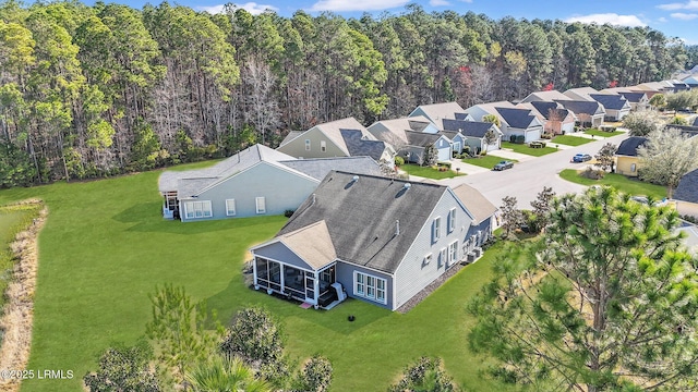 aerial view with a view of trees and a residential view