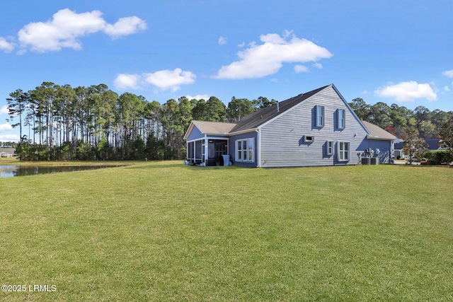 exterior space with a lawn and a sunroom