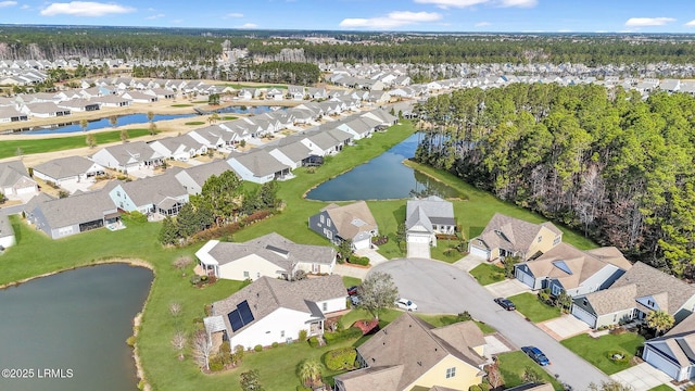 aerial view featuring a residential view and a water view