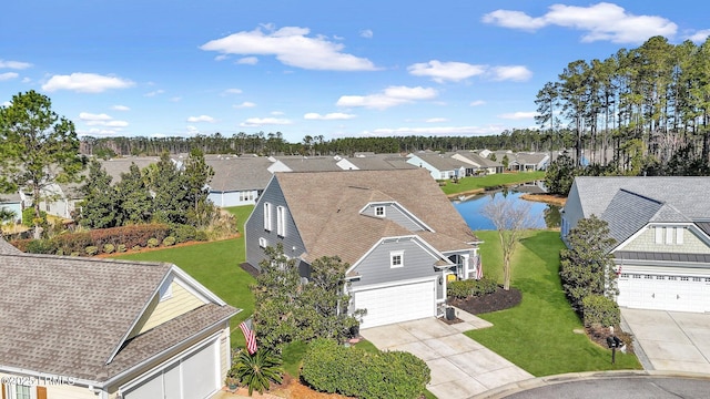 birds eye view of property featuring a residential view and a water view