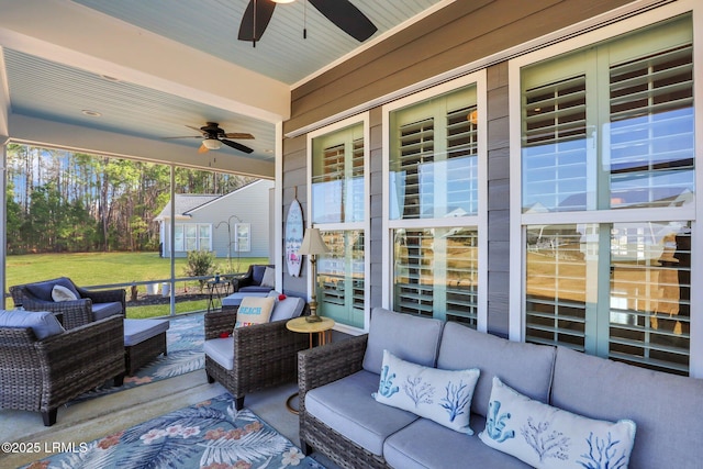 view of patio / terrace with an outdoor living space and a ceiling fan