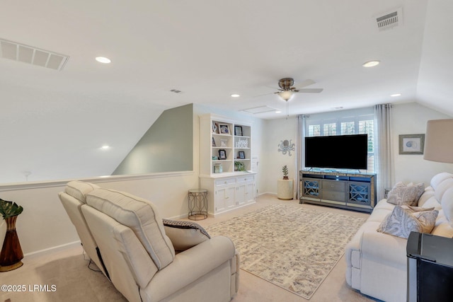 living area featuring vaulted ceiling, light colored carpet, visible vents, and baseboards