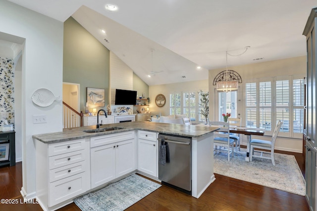 kitchen with a sink, lofted ceiling, dishwasher, and dark wood-style floors