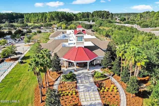 birds eye view of property with a wooded view