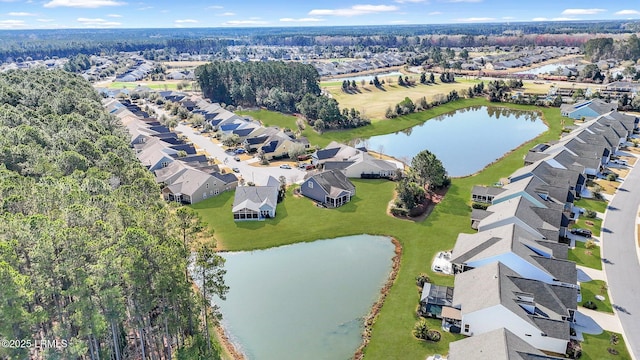 aerial view featuring a residential view and a water view