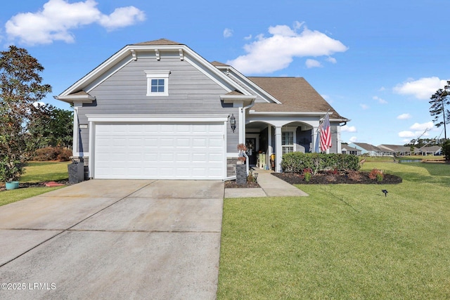 view of front of home with a garage, concrete driveway, and a front yard