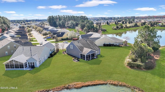 birds eye view of property with a residential view and a water view