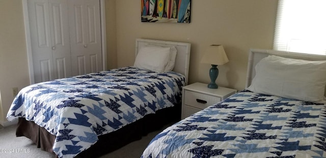 carpeted bedroom with a closet