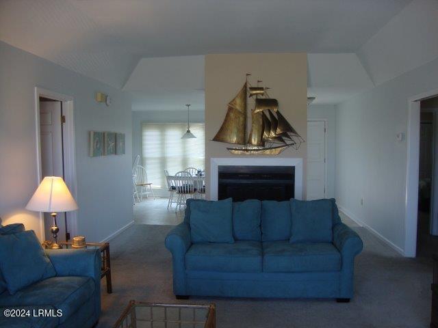 living room with dark carpet