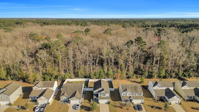 aerial view with a forest view and a residential view