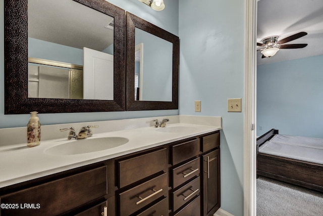 bathroom with ceiling fan, a sink, and double vanity