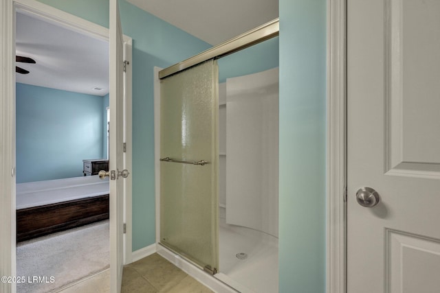 ensuite bathroom with a stall shower, tile patterned flooring, and ensuite bath