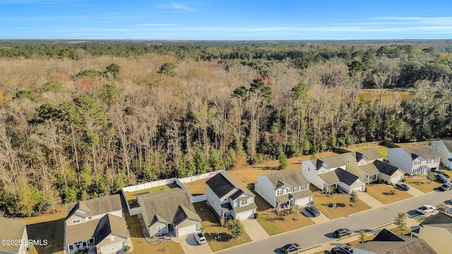 aerial view with a forest view and a residential view