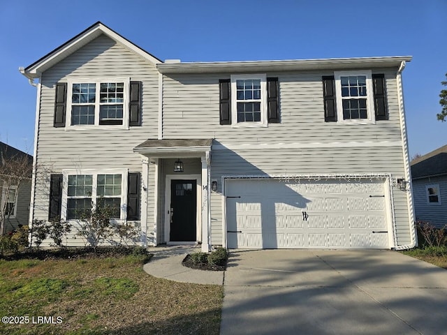 traditional-style home featuring driveway and an attached garage