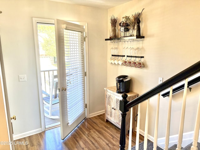 entryway with hardwood / wood-style flooring