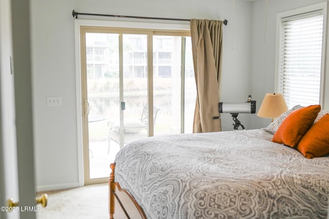 carpeted bedroom featuring access to exterior