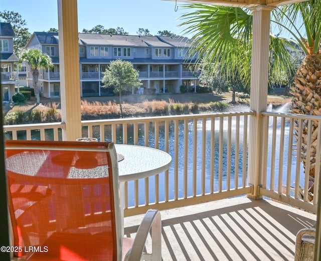 balcony featuring a water view