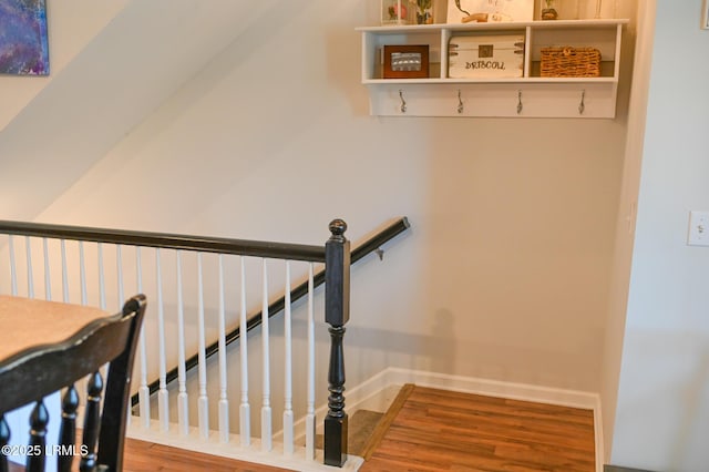 stairway featuring hardwood / wood-style floors