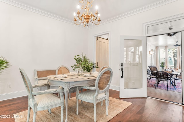 dining room featuring crown molding, dark wood finished floors, and baseboards