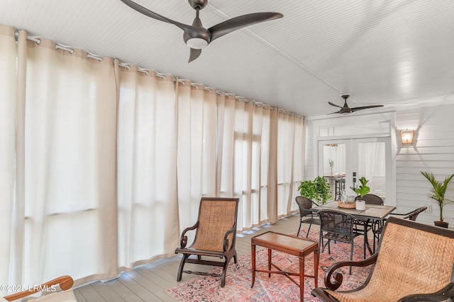 sunroom with ceiling fan and french doors