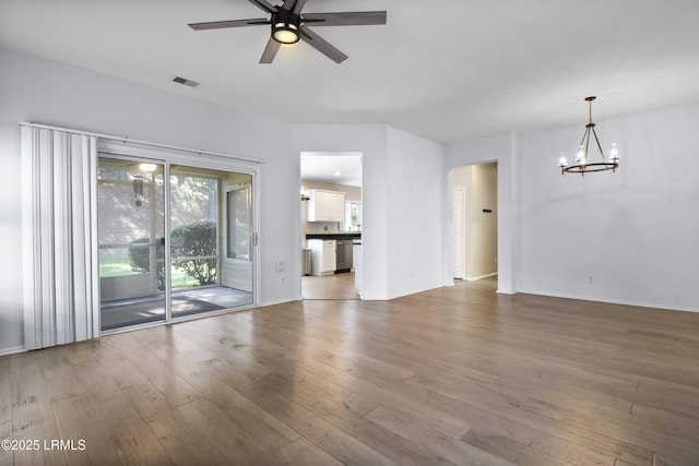 22 Purry Cir, Bluffton, SC 29909 - unfurnished living room featuring a chandelier, light wood finished floors, plenty of natural light, and a ceiling fan