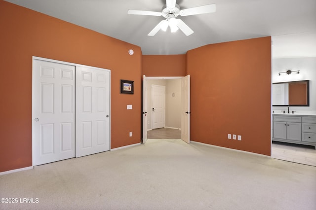 22 Purry Cir, Bluffton, SC 29909 - unfurnished bedroom with light carpet, a closet, lofted ceiling, ensuite bath, and ceiling fan