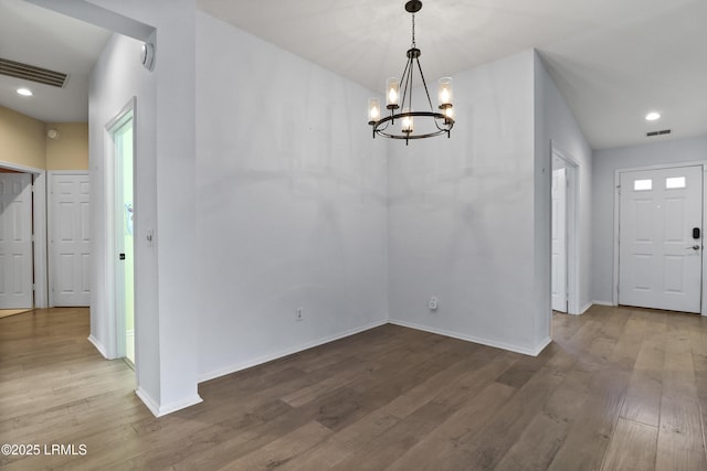 22 Purry Cir, Bluffton, SC 29909 - unfurnished dining area with wood finished floors, a chandelier, and recessed lighting