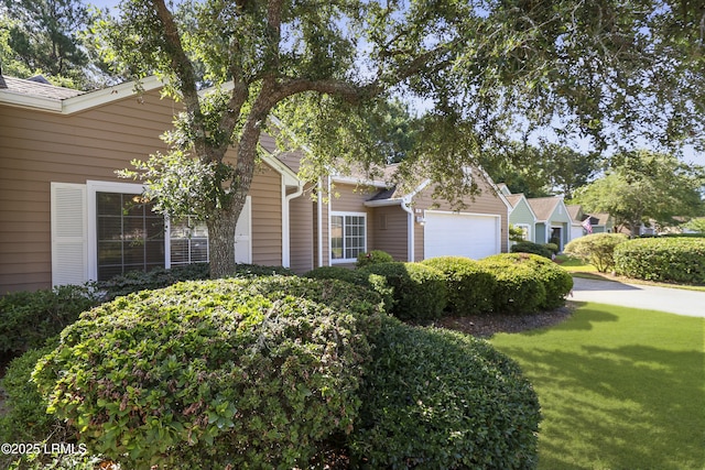 22 Purry Cir, Bluffton, SC 29909 - view of front of house with a garage and a front lawn