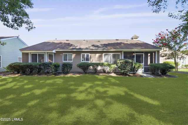 22 Purry Cir, Bluffton, SC 29909 - back of house with a lawn, a shingled roof, and a sunroom
